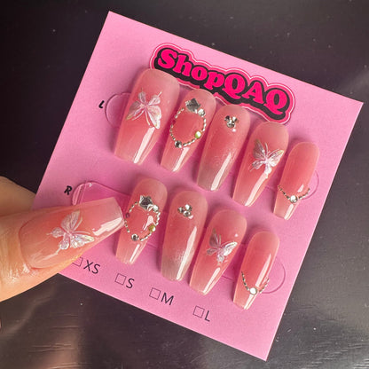 Here's a product description for your nail design:  "2024 New Year Crystal Butterfly Nails | Sweetheart Girl, Gentle & Clear, White-Enhancing Handcrafted Press-On Nails with Cat Eye and Blush Accents" | False Nails | False Nails, Handmade False Nails, press on nails | SHOPQAQ