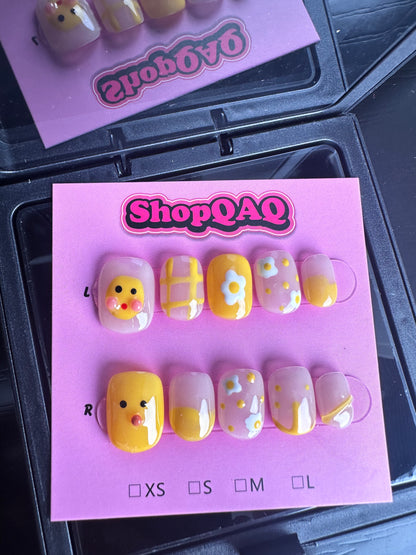 Here's an SEO-optimized English description for your product:  "Little Yellow Duck" Handcrafted Press-On Nails - Cute & Bright, Summer 2024 New Arrival, Hand-Painted Student-Friendly Nail Art False Nails from SHOPQAQ