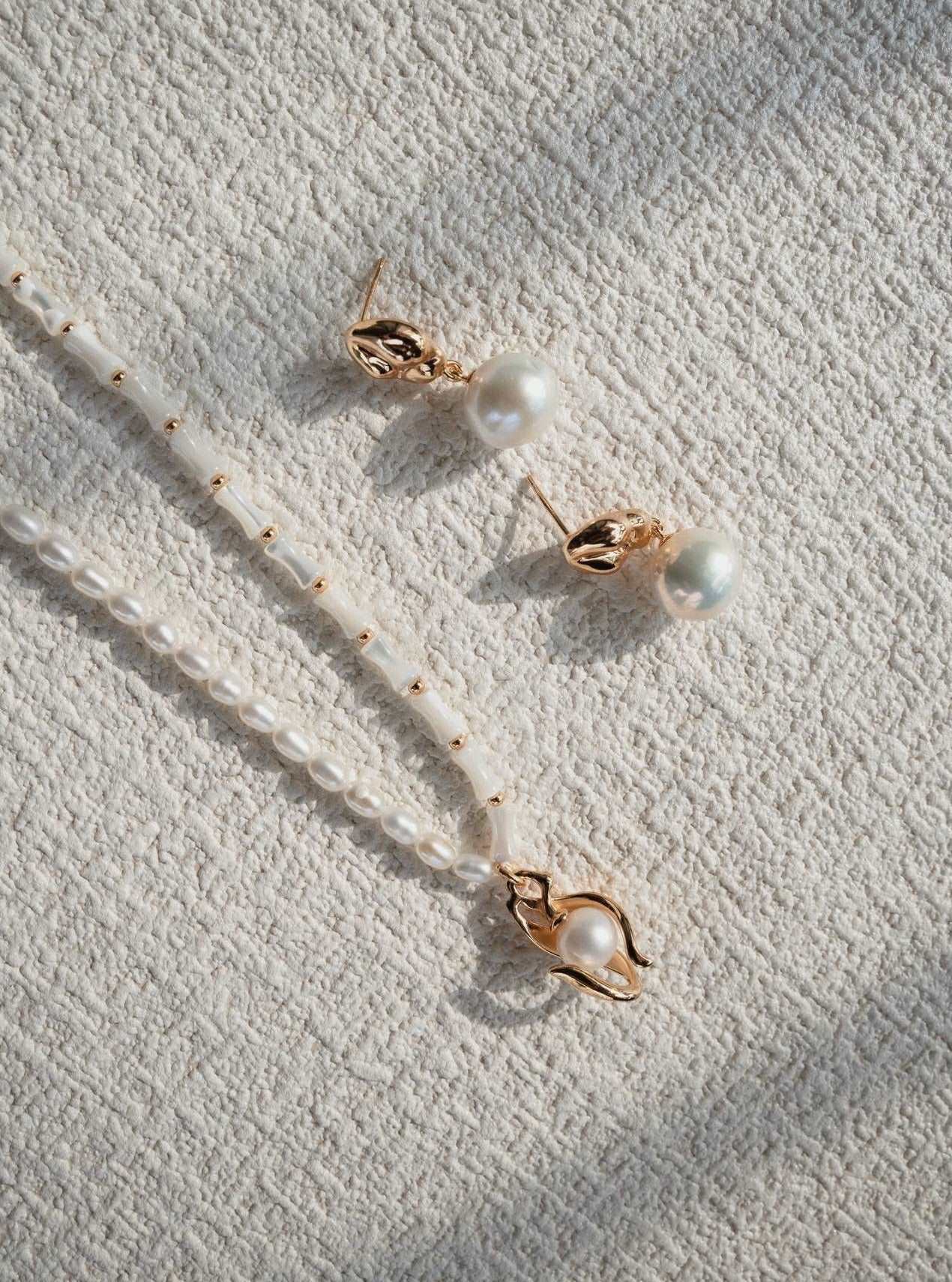 Asymmetrical Textured Pearl Earrings with Zircon Accents earrings from SHOPQAQ