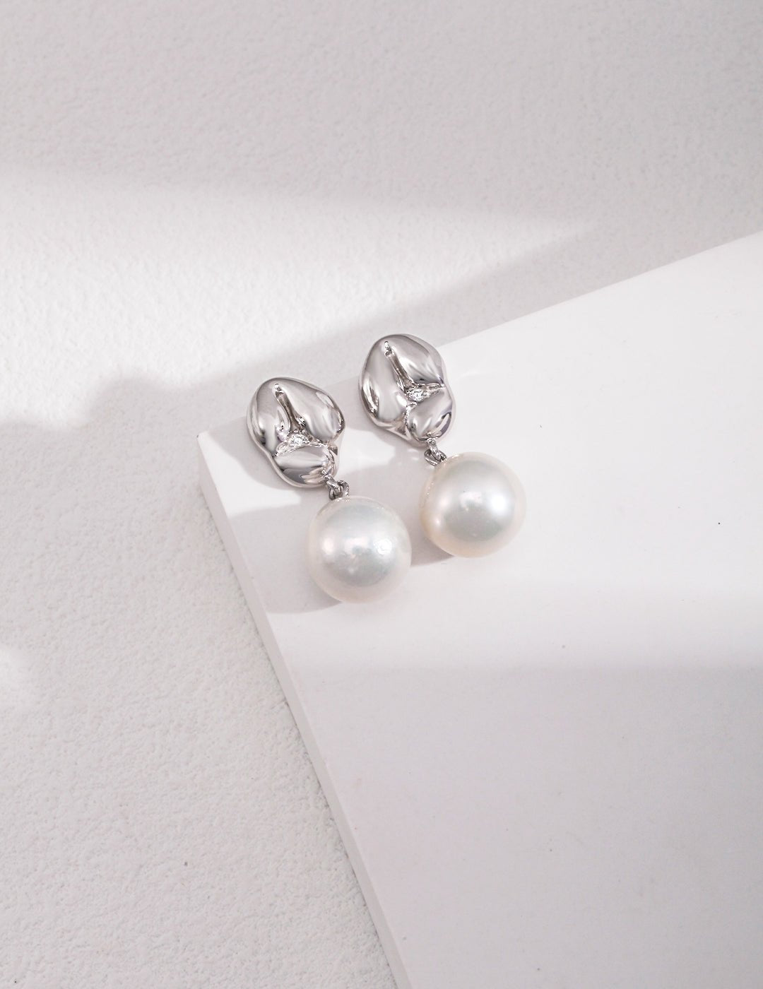 Asymmetrical Textured Pearl Earrings with Zircon Accents earrings from SHOPQAQ