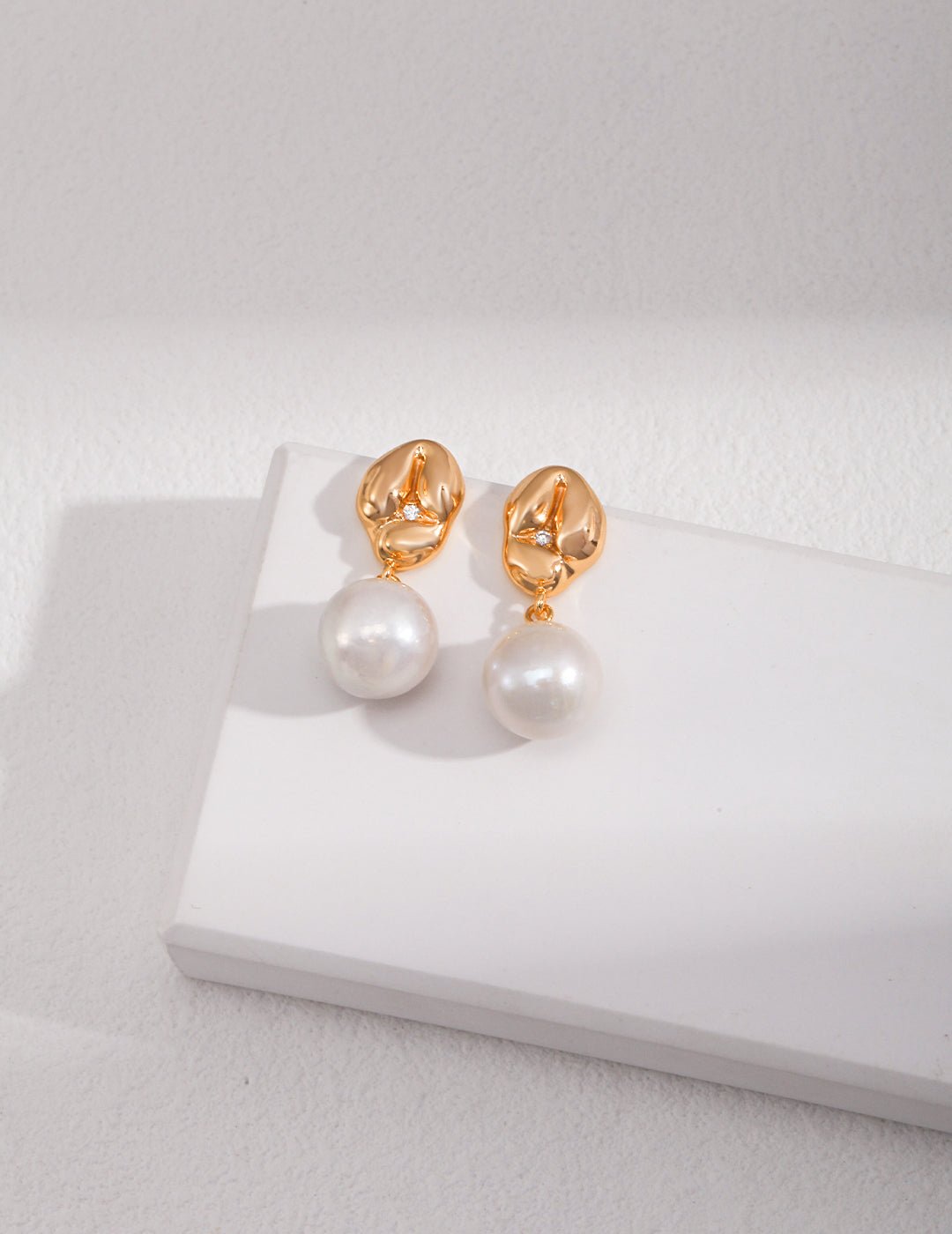 Asymmetrical Textured Pearl Earrings with Zircon Accents earrings from SHOPQAQ