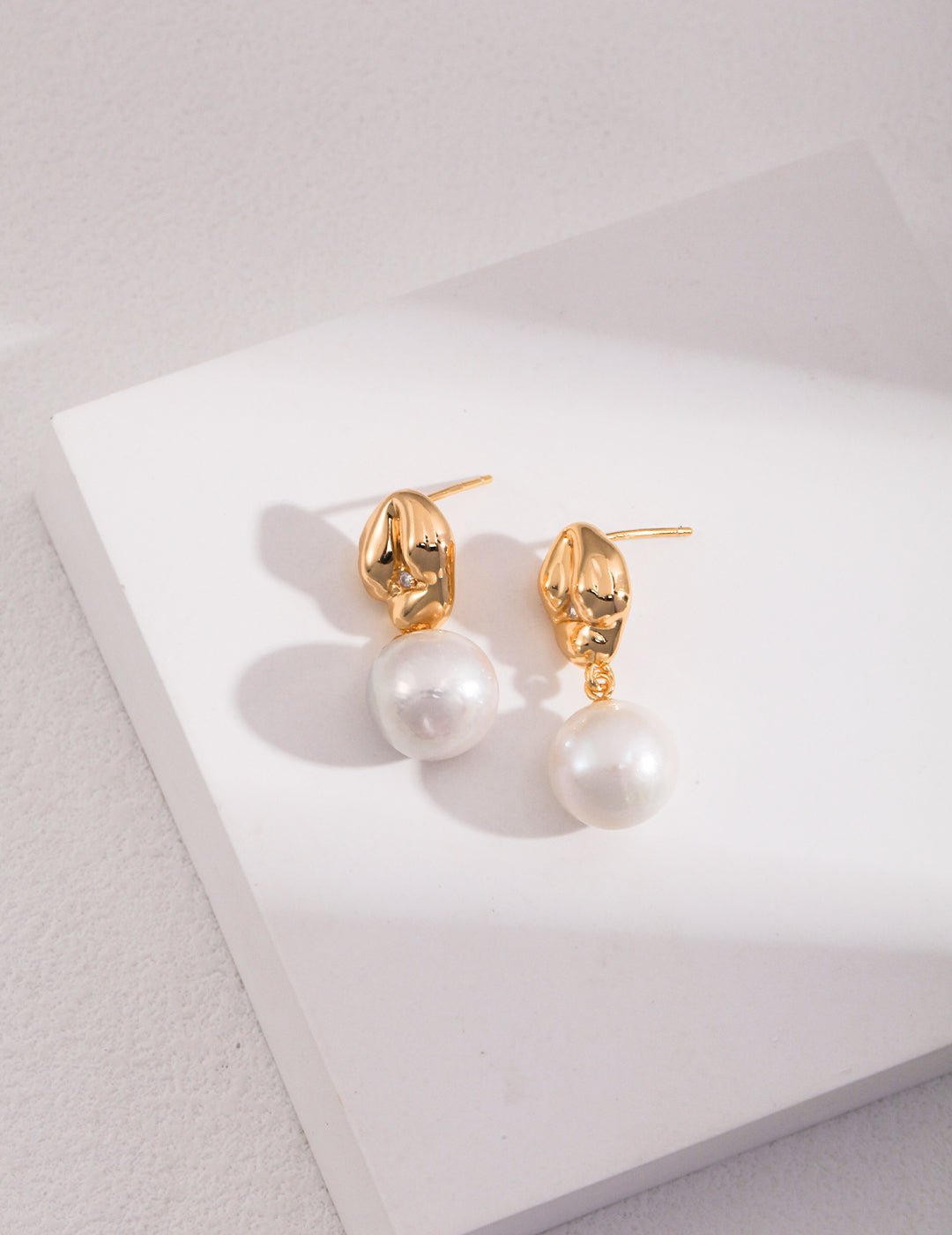 Asymmetrical Textured Pearl Earrings with Zircon Accents earrings from SHOPQAQ